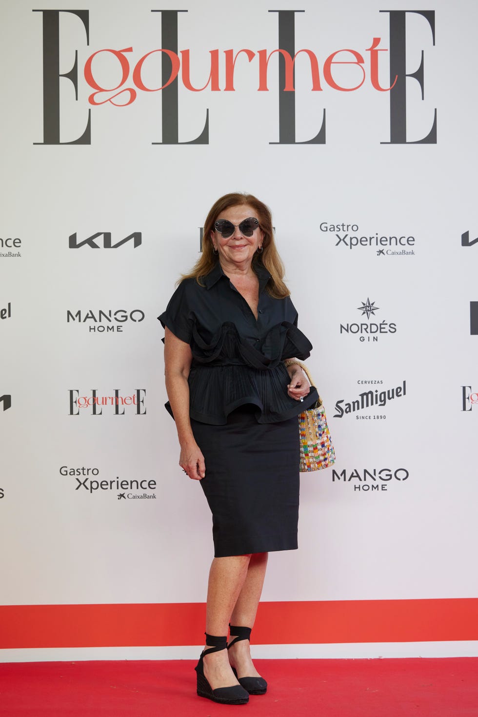 a person standing on a red carpet