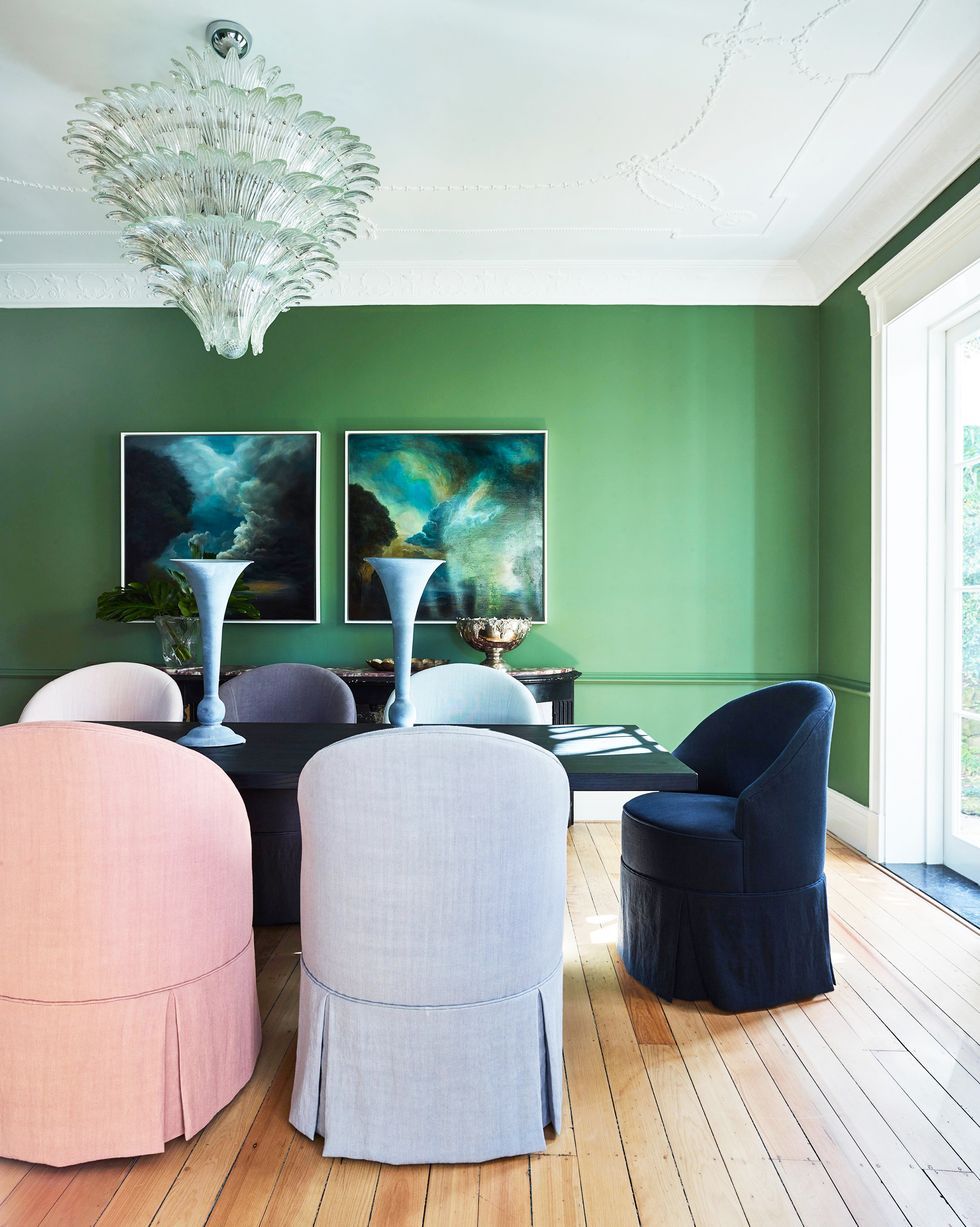 a living room with a green wall