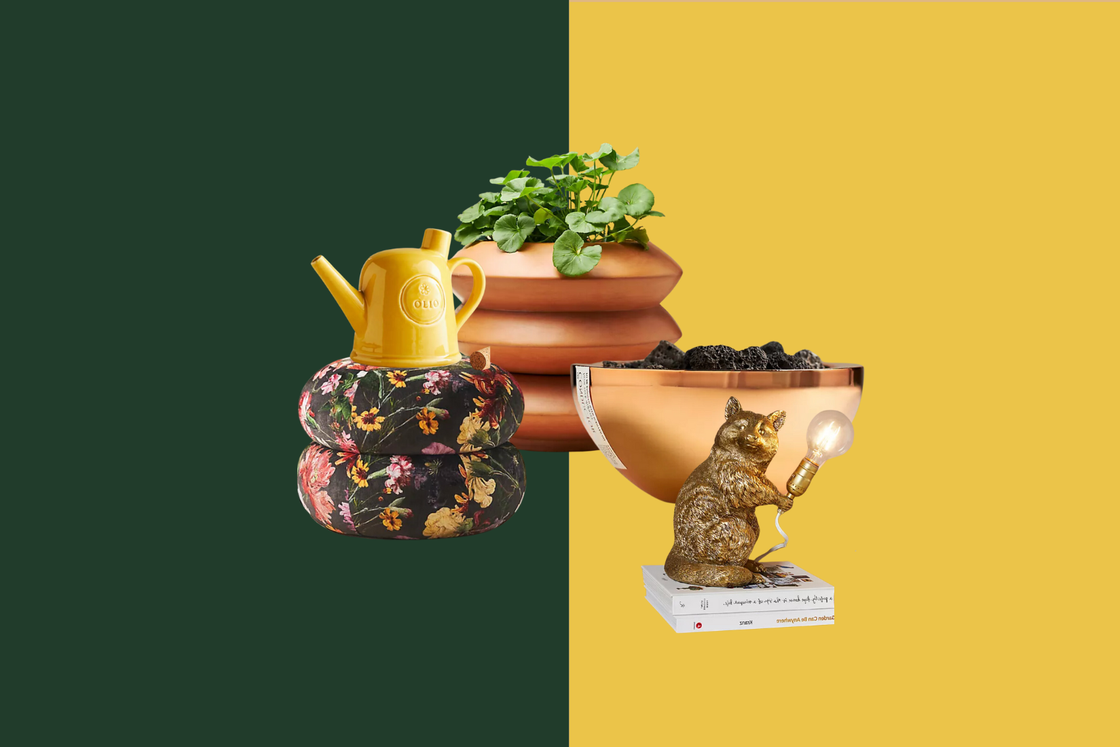 decorative items including a watering can a plant pot a bowl and a figurine