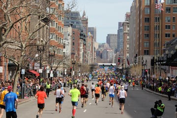 Runners head down Boylston Street toward the Boston Marathon finish line.