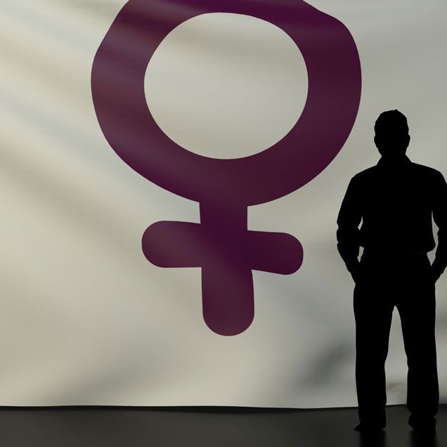 A man standing in front of the female symbol.