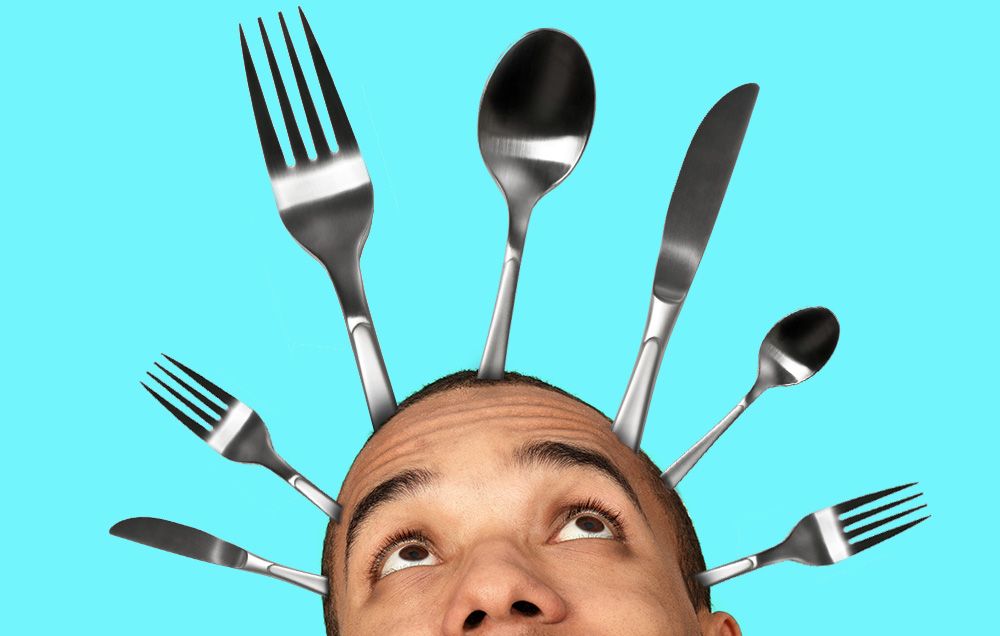man with silverware sprouting from his head