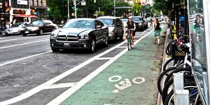 woman cycling in new york city bike lane