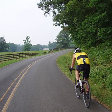 A cyclist on a country road. 