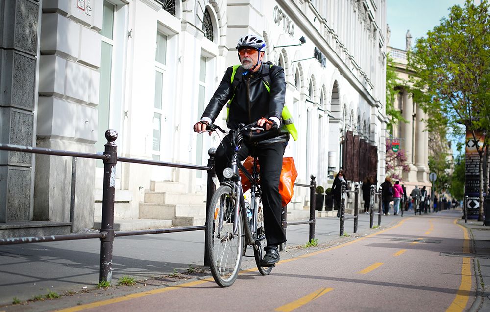 man riding bike path in budapest hungary