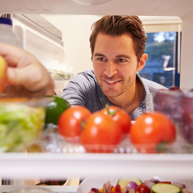 Man looking in refrigerator