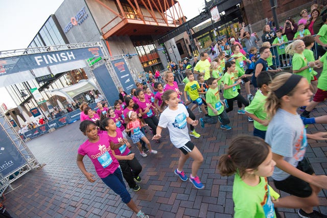 Young girls running at the RW Festival.