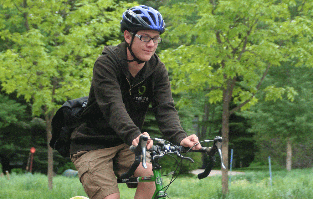 teen bike commuter in the summer