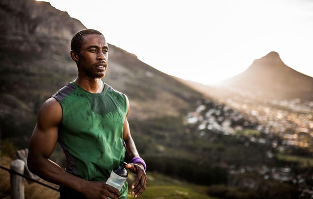 A sweaty runner with a drink