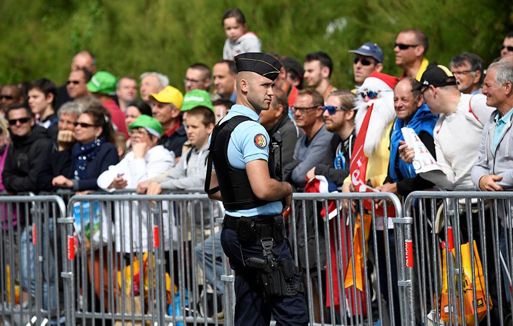 A policeman watching the Tour crowd. 