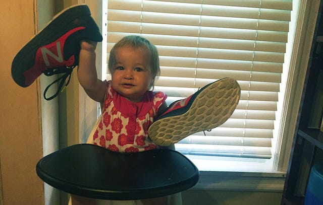 toddler with running shoes