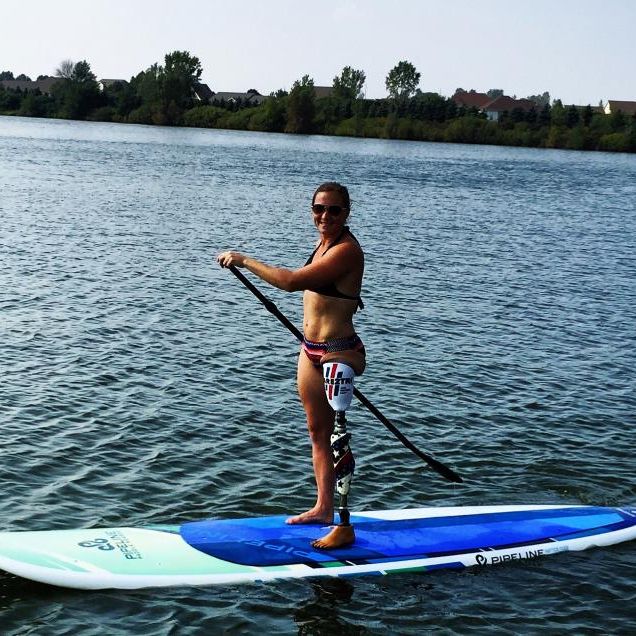 Stand-up paddleboard with prosthetic leg
