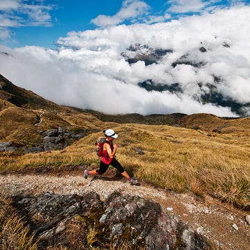 A runner on hills in New Zealand A runner on hills in New Zealand