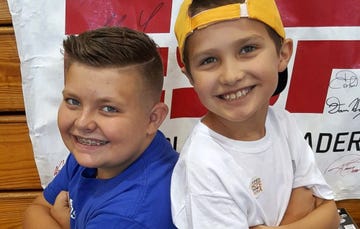 boy sells babseball cards to help friend with cancer