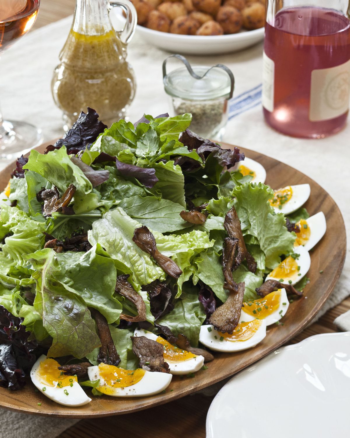arugula and baby lettuce salad with soft boiled eggs and roasted oyster mushrooms