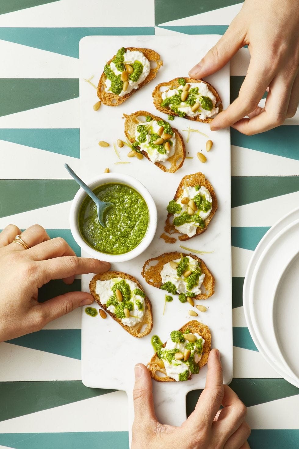 arugula pesto on pieces of toast