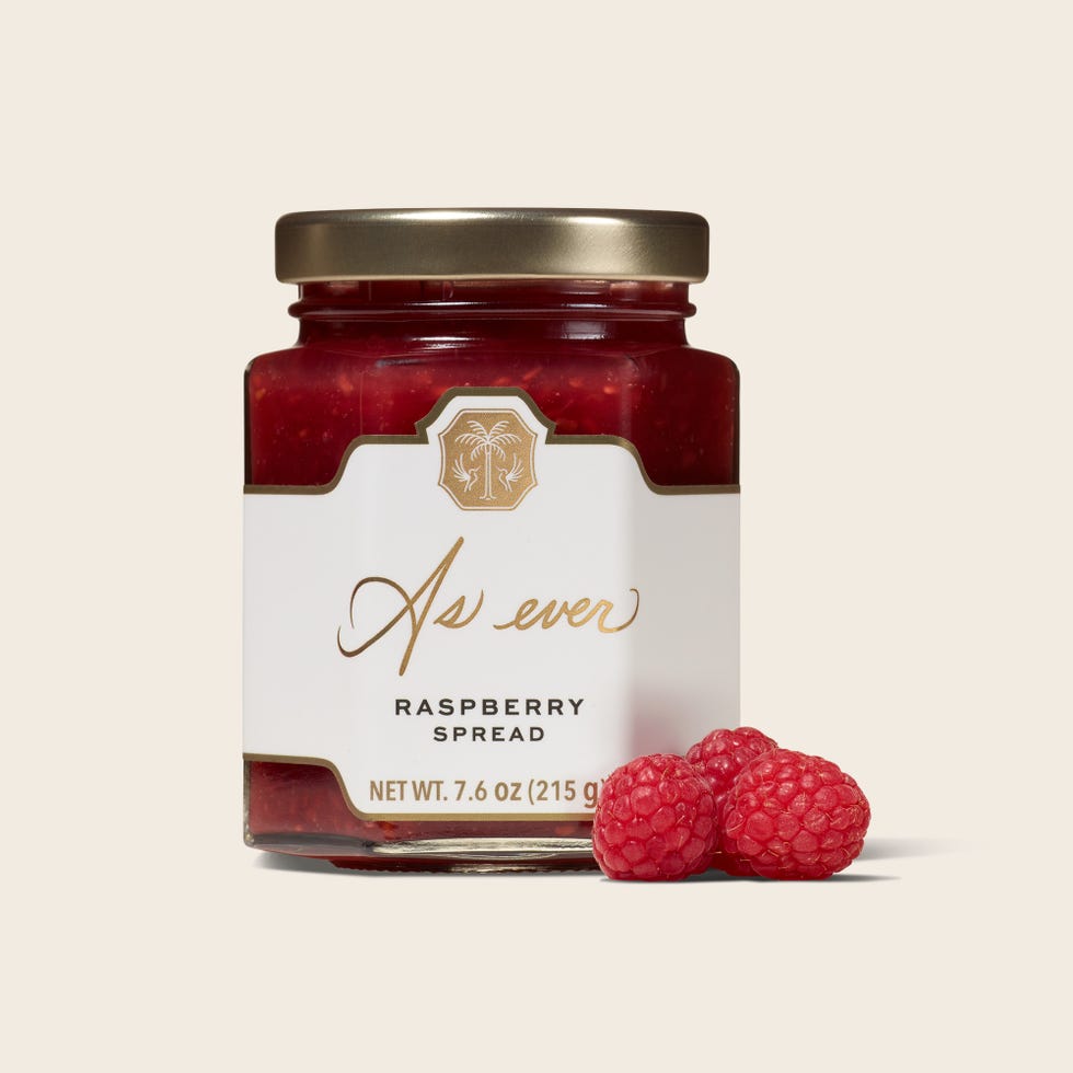 raspberry spread jar with raspberries beside it