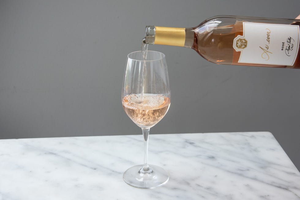 meghan markle as ever rose wine poured into a glass