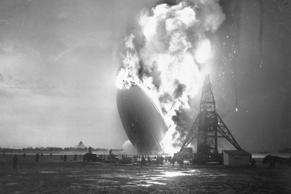 crew members fleeing from burning hindenburg airship