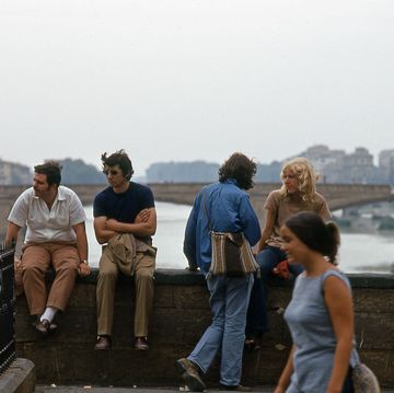 people on the tiber river bridge