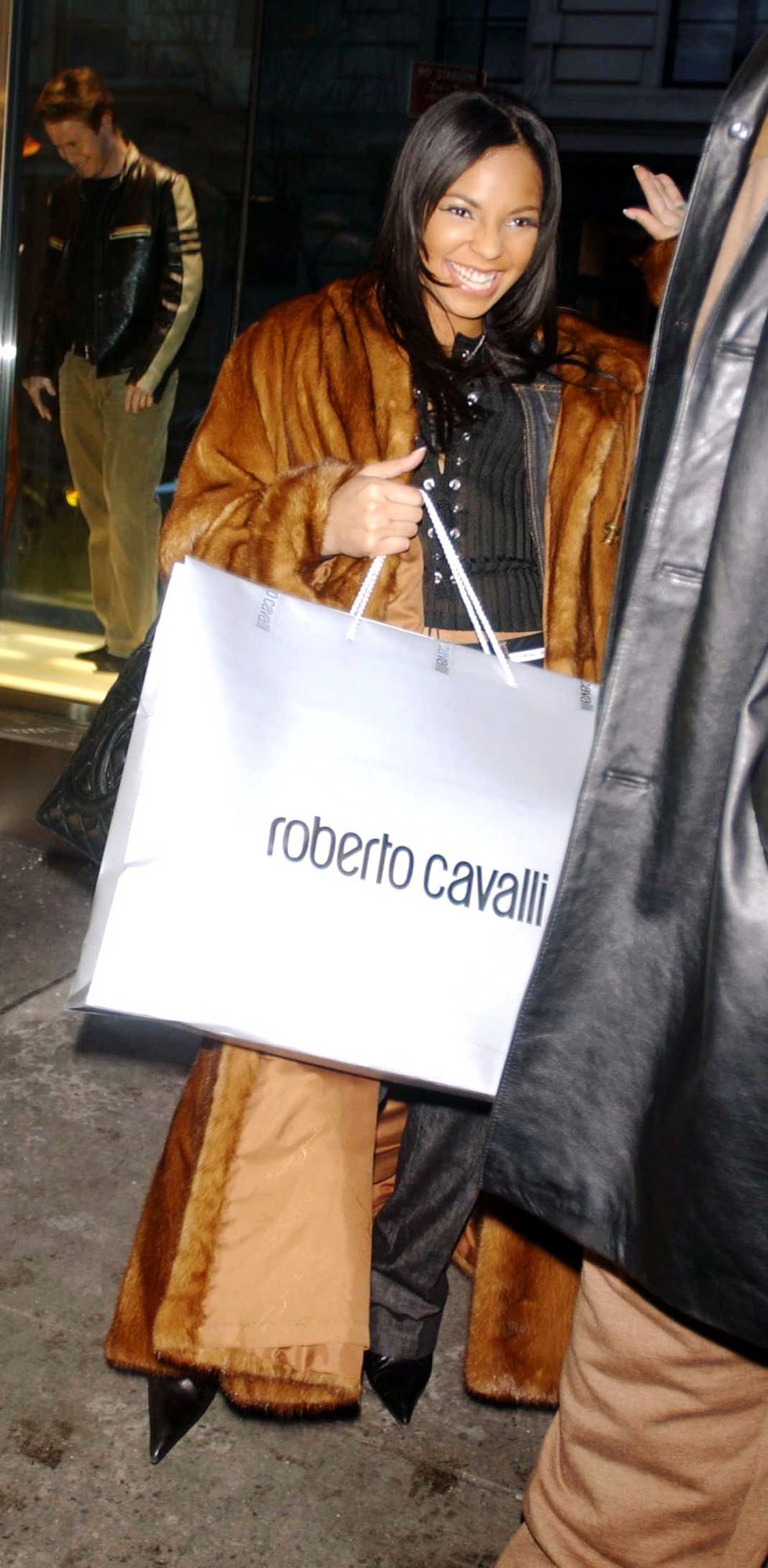 ashanti carrying a roberto cavalli shopping bag in 2003