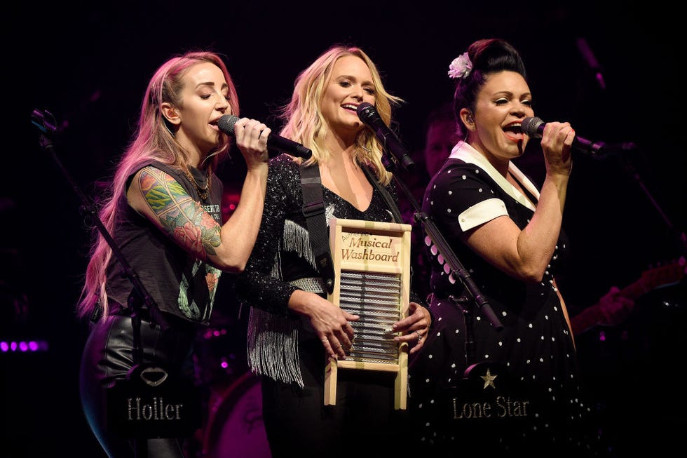 ashley monroe, miranda lambert, angaleena presley sing into microphones while standing close together on a stage