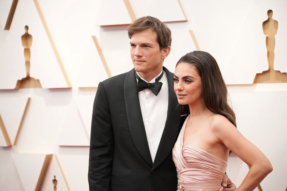 ashton kutcher and mila kunis attend the 94th annual academy award