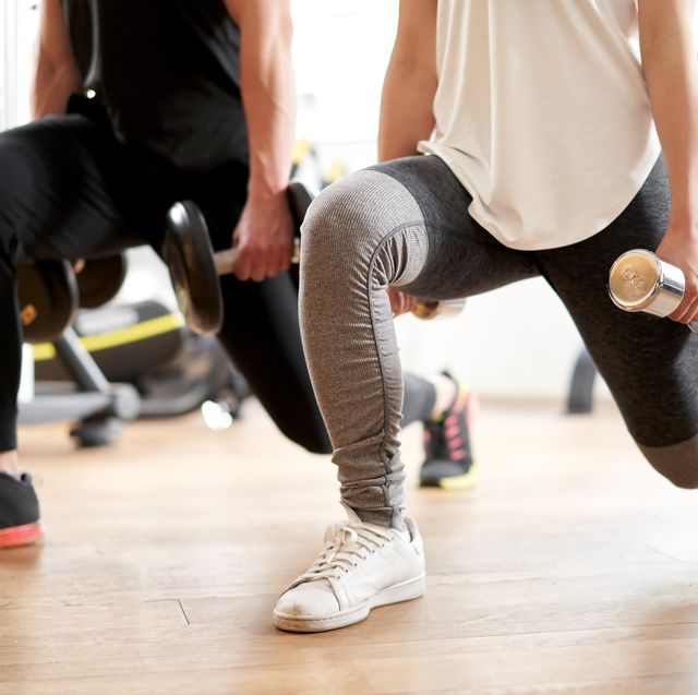 asian couple doing dumbbell front lunge