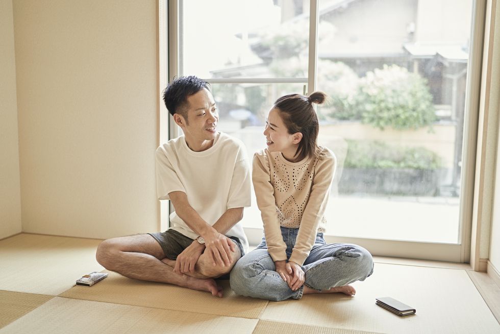 asian couple relaxing in the japanese style room at home