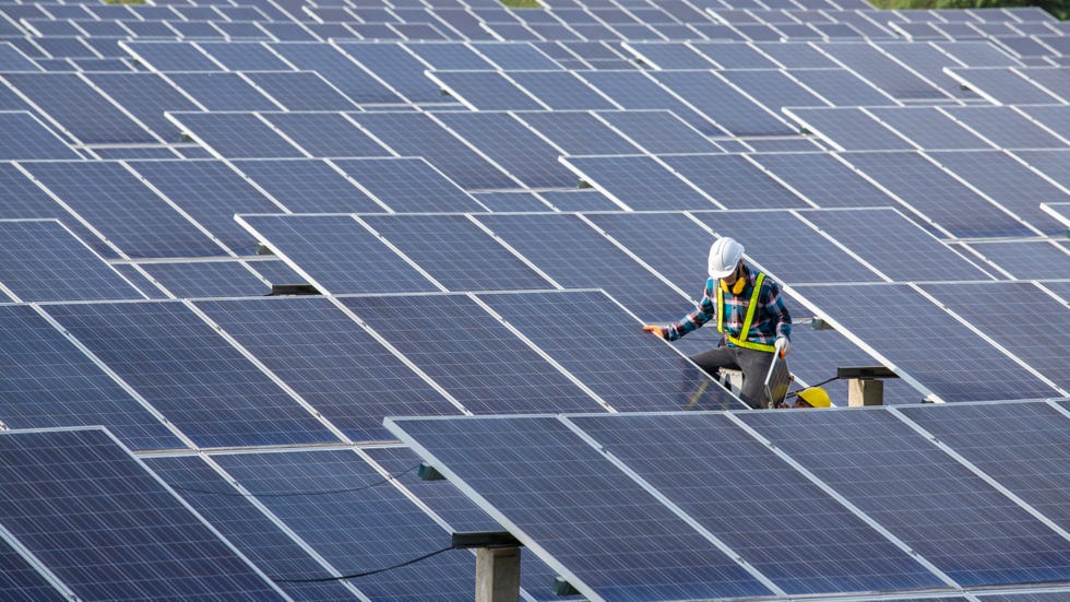 how do solar panels work, asian engineer working on checking equipment in solar power plant, pure energy, renewable energy