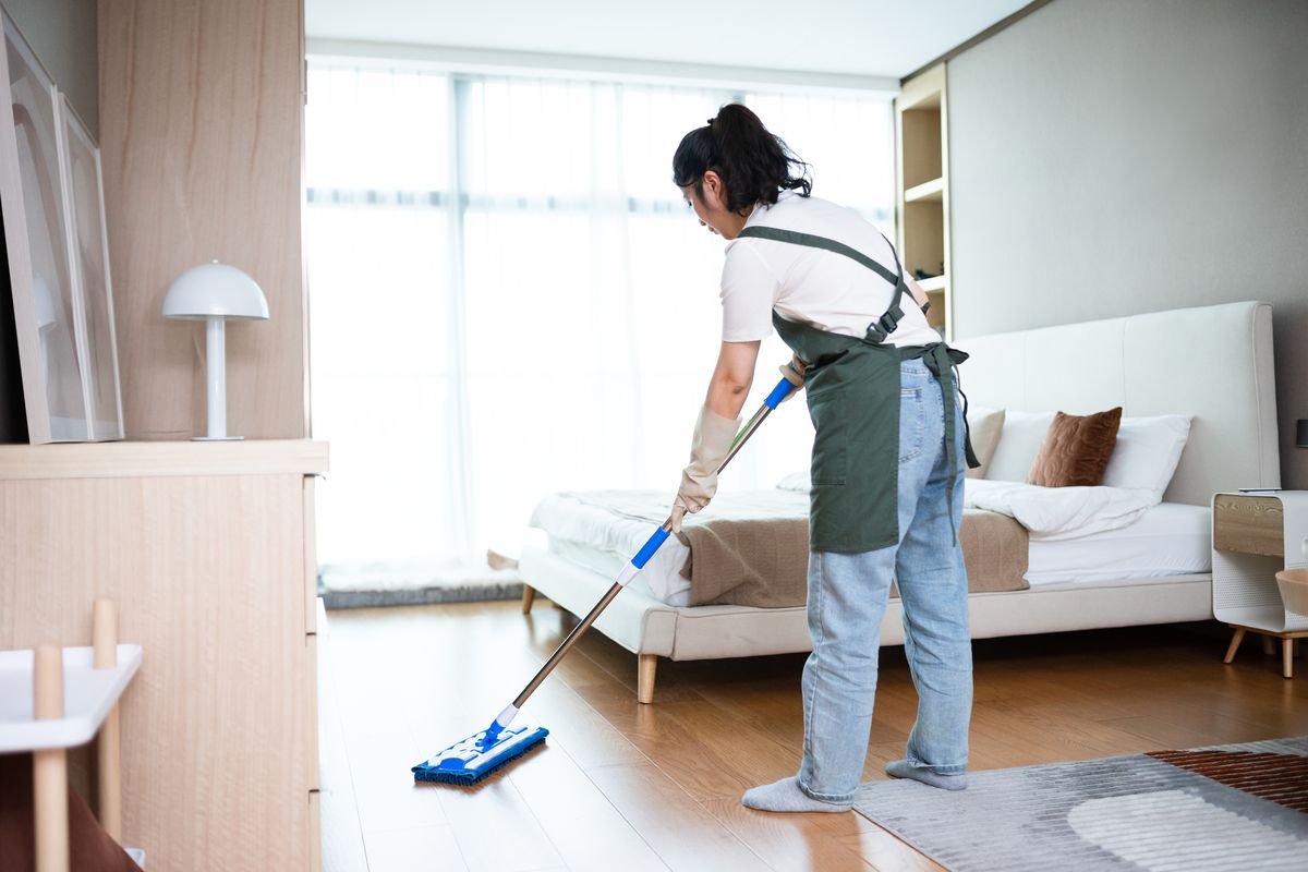 asian female Cleaning Floor With Mop