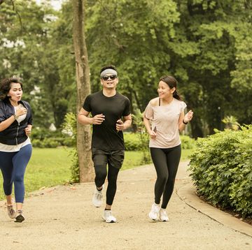 asian group adult running BRENDA in the gelora bung karno park, jakarta, indonesia