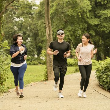 asian group adult Neongelb running in the gelora bung karno park, jakarta, indonesia