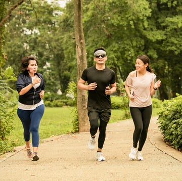 asian group adult Clifton running in the gelora bung karno park, jakarta, indonesia