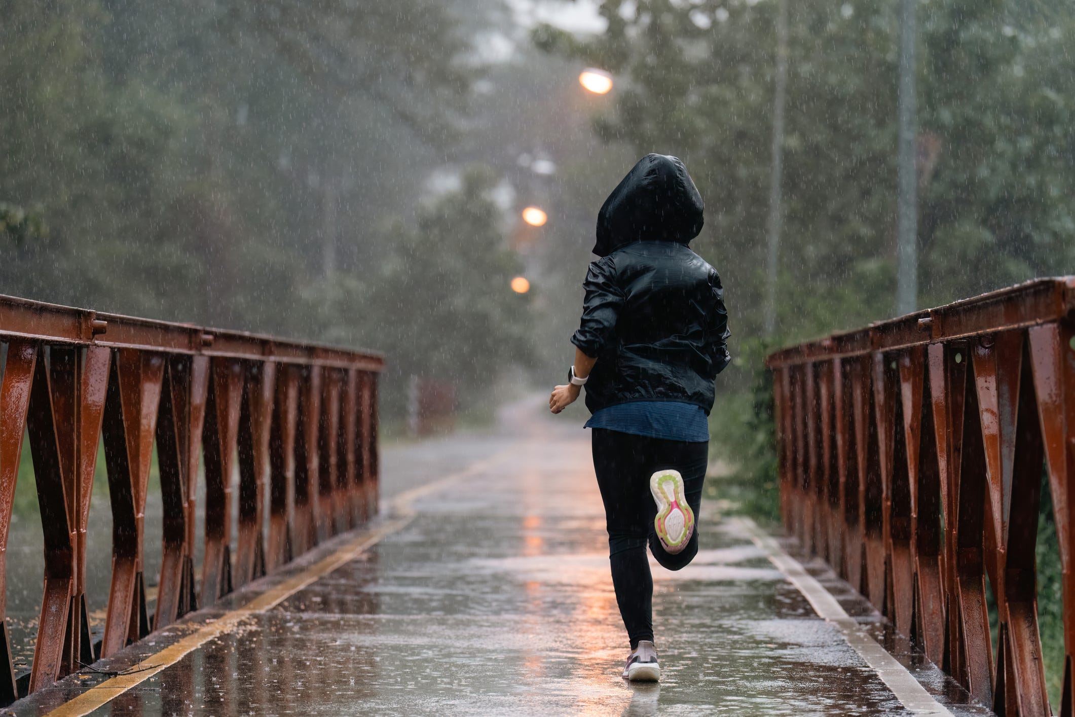 asian ladies running in the rain