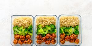 Asian style chicken meat balls with broccoli and rice in a take away lunch boxes