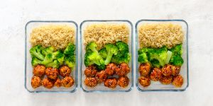 Asian style chicken meat balls with broccoli and rice in a take away lunch boxes