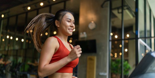 https://hips.hearstapps.com/hmg-prod/images/asian-woman-running-on-treadmill-glowing-in-royalty-free-image-1734730350.pjpeg?crop=1.00xw:0.753xh;0,0.0384xh&resize=640:*