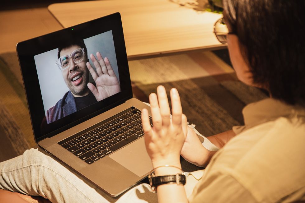 asian woman video conference with asian man