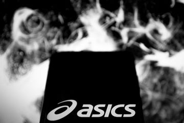 editors note this image has been converted to black and white in this photo illustration a asics logo is displayed on a smartphone on march 16, 2020 in athens, greece photo by nikolas kokovlisnurphoto via getty images