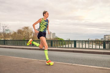 eilish mccolgan running along an empty road