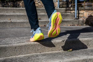 running shoes in motion on concrete stairs