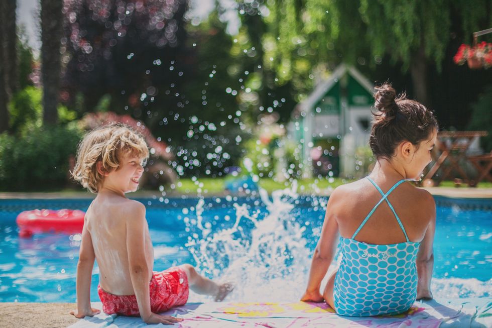 two kids having fun in pool