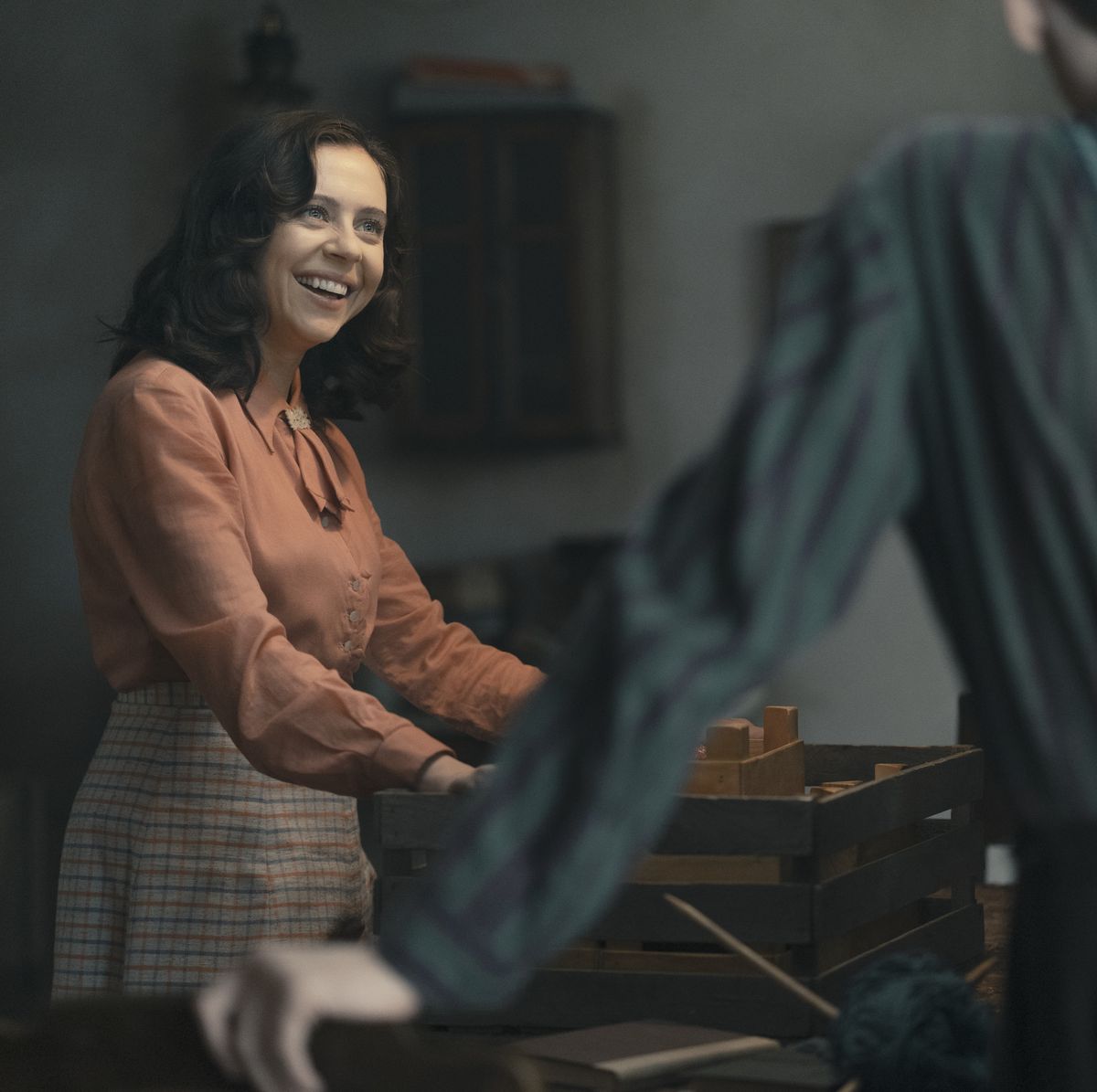 miep gies, played by bel powley, delivers a surprise of fresh strawberries to the annex as seen in a small light credit national geographic for disneymartin mlaka