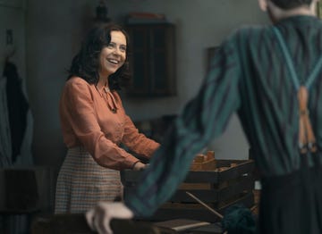miep gies, played by bel powley, delivers a surprise of fresh strawberries to the annex as seen in a small light credit national geographic for disneymartin mlaka