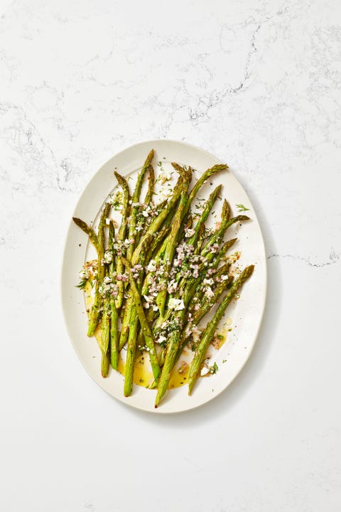 roasted asparagus salad with feta vinaigrette on a white plate