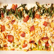 cheesy bacon asparagus casserole topped with crushed ritz crackers