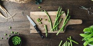 asparagus on a wooden chopping board
