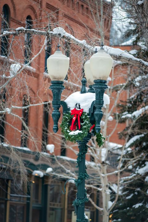 aspen colorado street lamp closeup with snow and holiday decorations