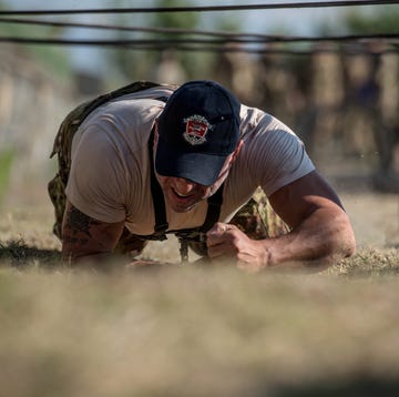 a man bending over to touch the ground